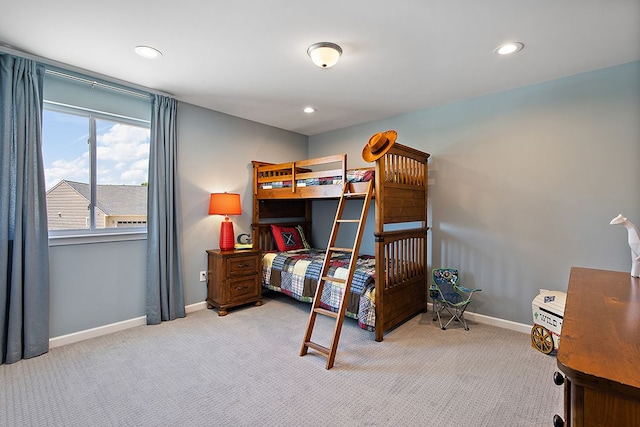 bedroom featuring light colored carpet