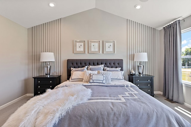 bedroom with carpet floors and lofted ceiling