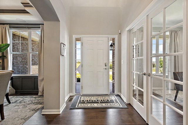 entryway featuring french doors and dark wood-type flooring