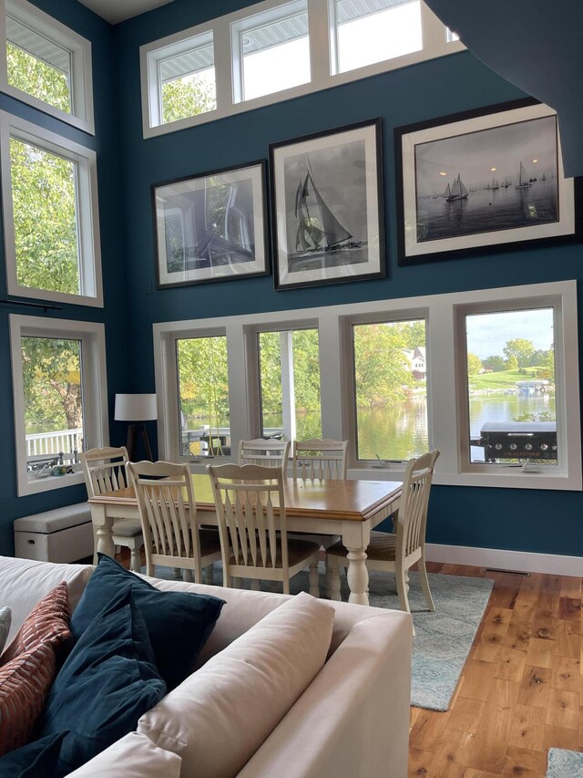 23739 Grandview Ct, Sturgis, MI 49091 - dining room with hardwood / wood-style flooring and a towering ceiling