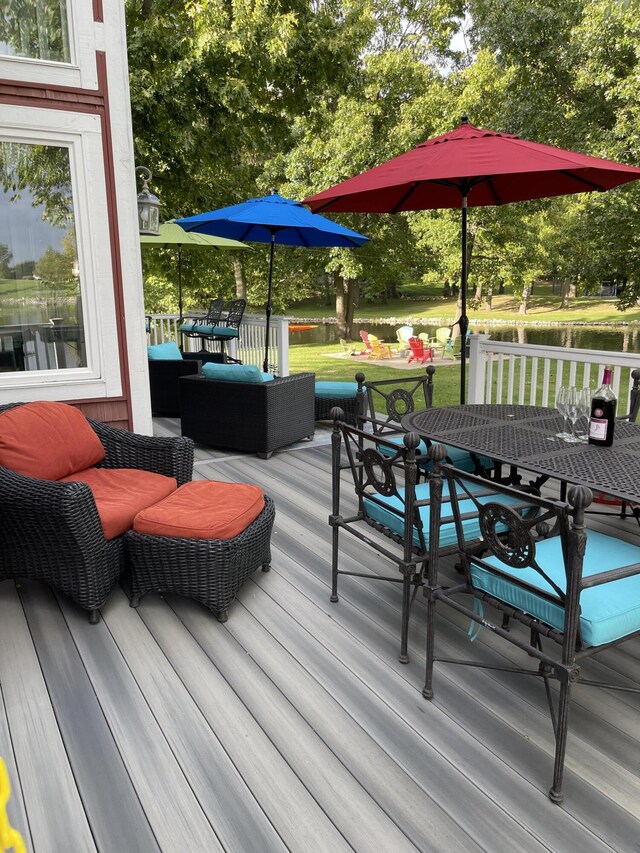 23739 Grandview Ct, Sturgis, MI 49091 - wooden terrace with outdoor dining area, a yard, an outdoor hangout area, and view of wooded area