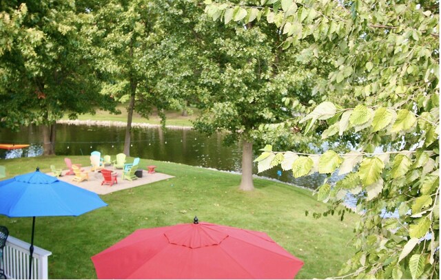 23739 Grandview Ct, Sturgis, MI 49091 - view of green lawn featuring a water view and a patio