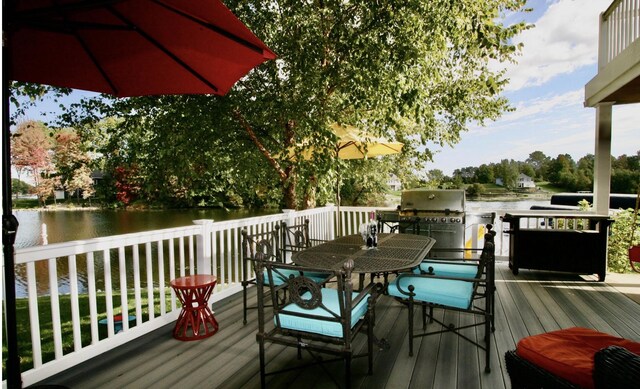 23739 Grandview Ct, Sturgis, MI 49091 - wooden terrace featuring a water view, outdoor dining area, and a grill