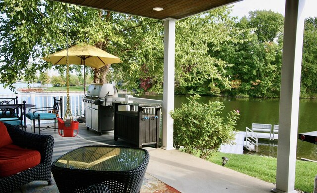 23739 Grandview Ct, Sturgis, MI 49091 - view of patio featuring a grill, view of scattered trees, and a deck with water view