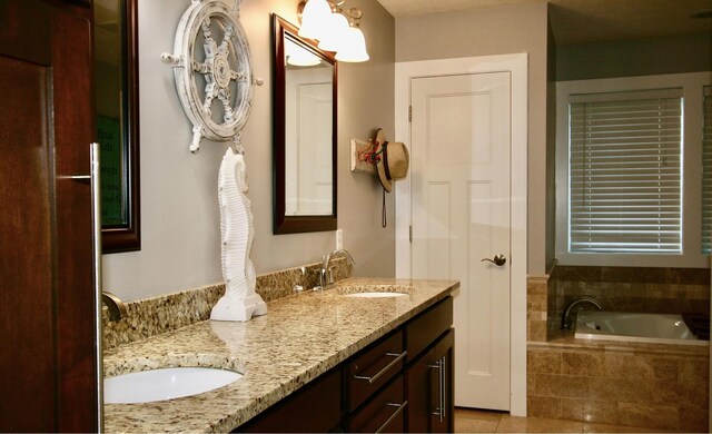 23739 Grandview Ct, Sturgis, MI 49091 - bathroom featuring double vanity, a bath, and tile patterned floors