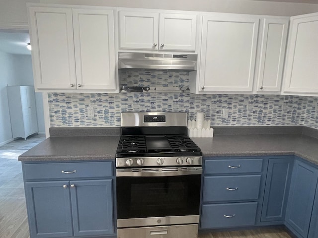 kitchen with backsplash, gas stove, white cabinetry, and blue cabinetry