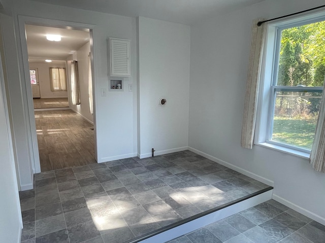 empty room featuring dark hardwood / wood-style flooring