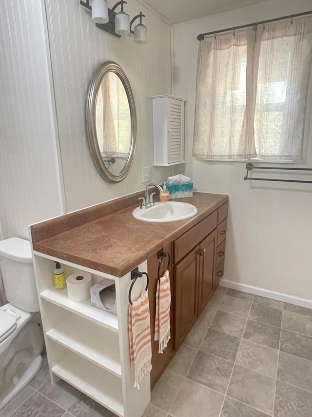 bathroom with vanity and toilet