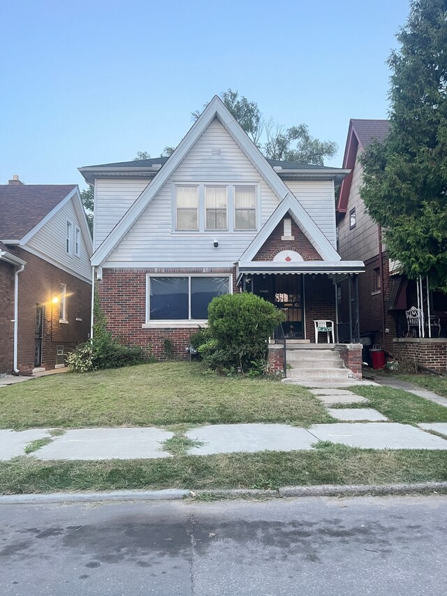 view of front of home with a front lawn and a porch