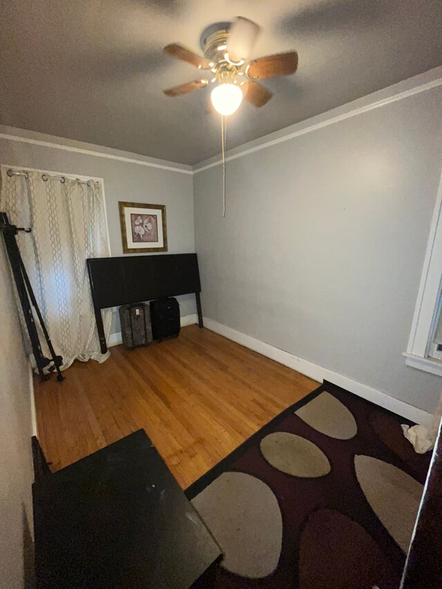 15782 Ohio St, Detroit, MI 48238 - living area featuring baseboards, a ceiling fan, wood finished floors, and ornamental molding