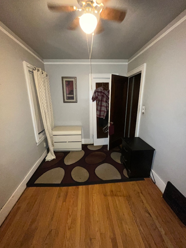 15782 Ohio St, Detroit, MI 48238 - dining room with wood finished floors, ornamental molding, baseboards, and ceiling fan