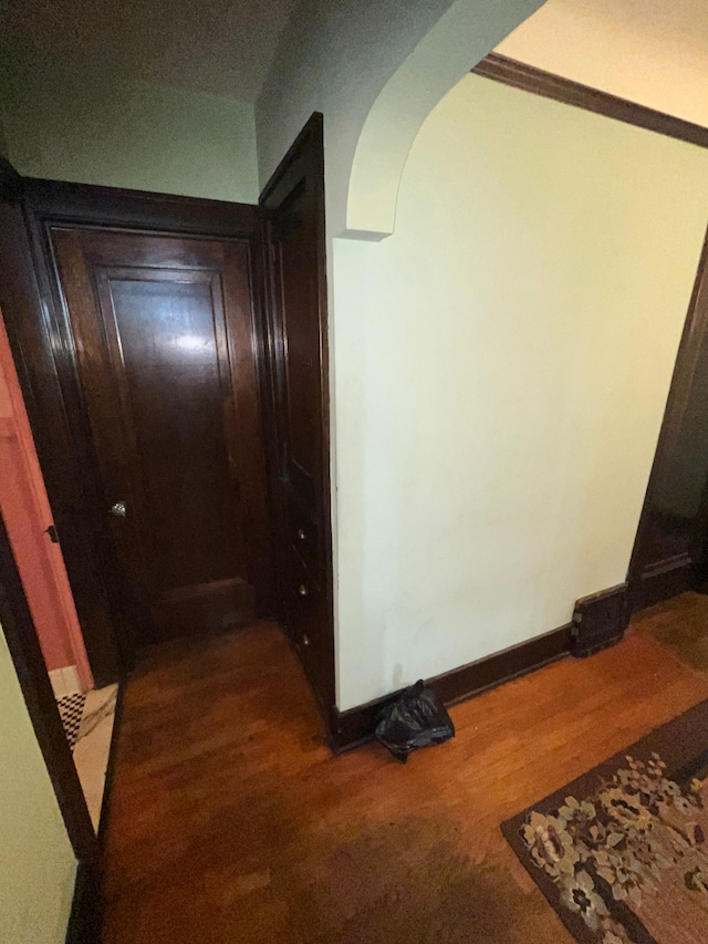 15782 Ohio St, Detroit, MI 48238 - hall featuring arched walkways, wood finished floors, and baseboards