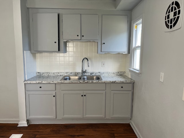 kitchen featuring sink, a healthy amount of sunlight, and dark hardwood / wood-style floors