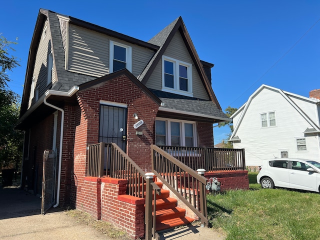 15361 Wisconsin St, Detroit, MI 48238 - view of front of home featuring brick siding, roof with shingles, and a front yard