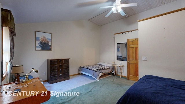 carpeted bedroom featuring lofted ceiling, baseboards, and ceiling fan