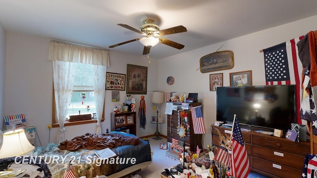 carpeted bedroom with baseboards and ceiling fan