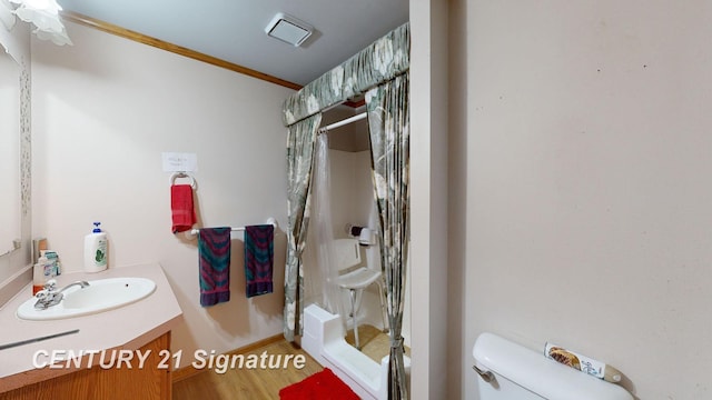 full bath featuring vanity, wood finished floors, a stall shower, crown molding, and toilet