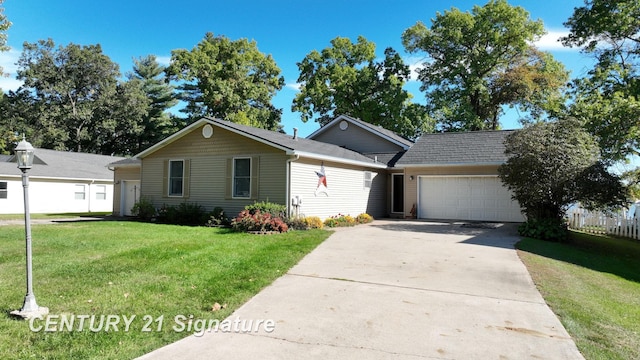 ranch-style house featuring a front yard and a garage