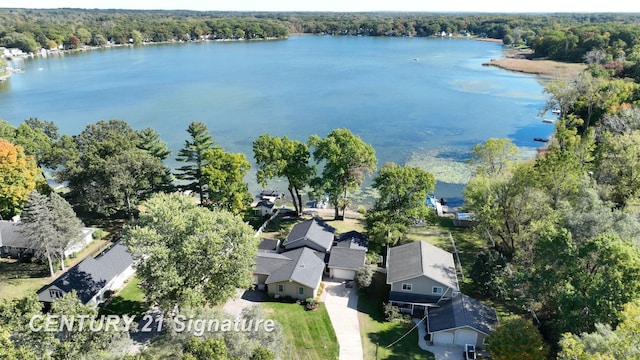 bird's eye view with a forest view and a water view