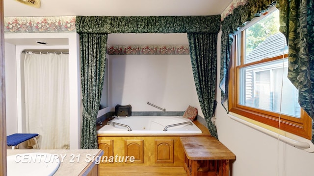 bathroom with a whirlpool tub