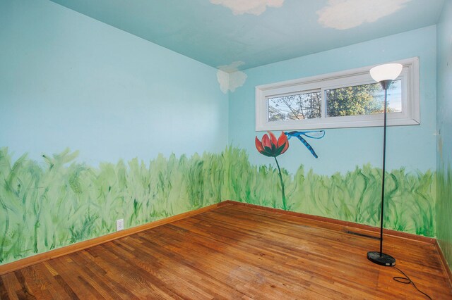 empty room featuring hardwood / wood-style flooring