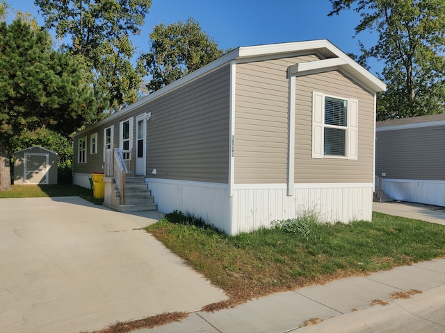 view of front of home featuring a shed