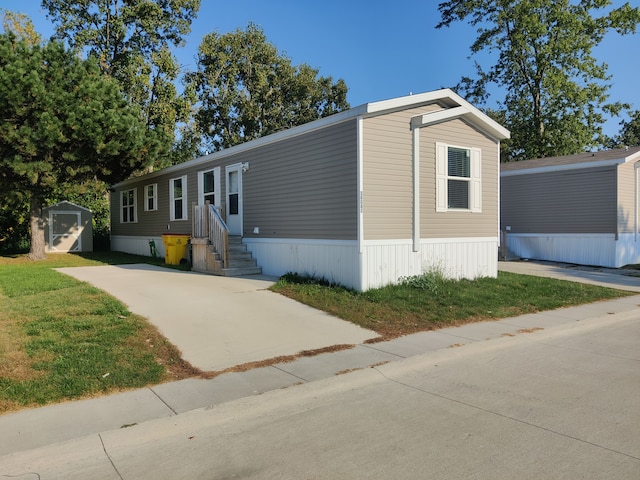 manufactured / mobile home with a storage shed