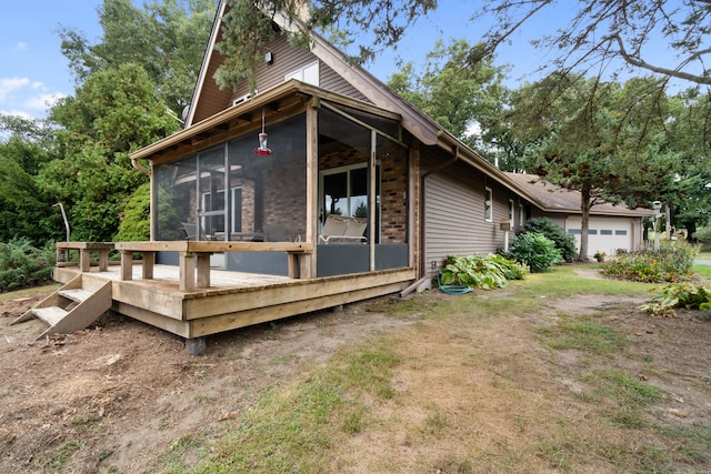 view of property exterior with a wooden deck and a sunroom