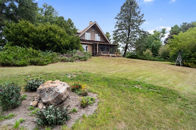 view of yard with a sunroom