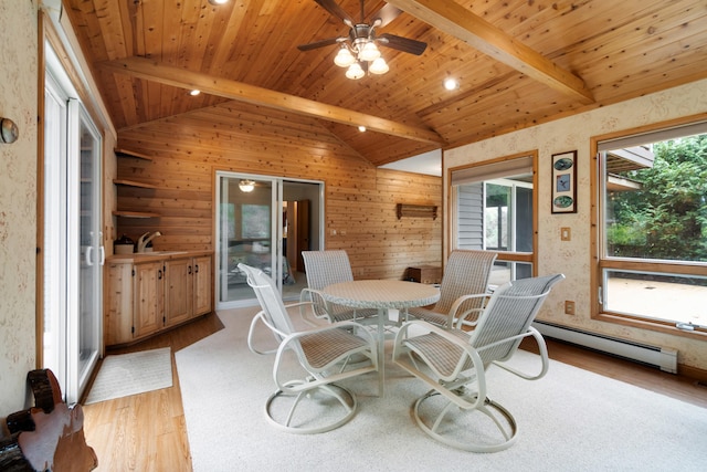 sunroom with wood ceiling, a baseboard heating unit, vaulted ceiling with beams, sink, and ceiling fan