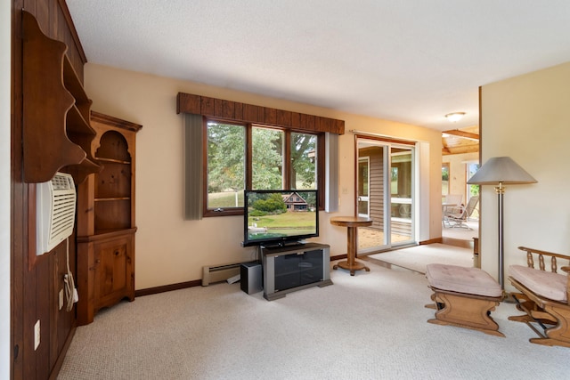 carpeted living room featuring a baseboard heating unit