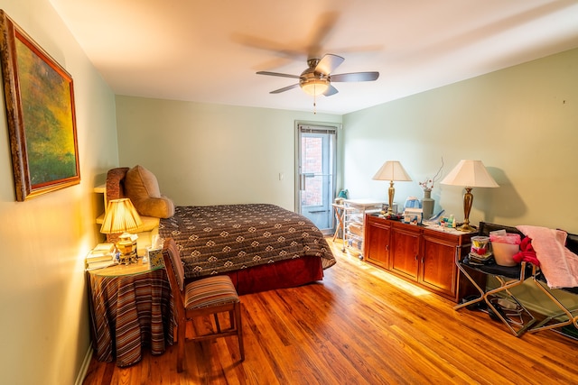 bedroom featuring ceiling fan and light hardwood / wood-style flooring