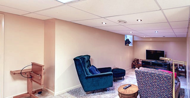 sitting room with a paneled ceiling