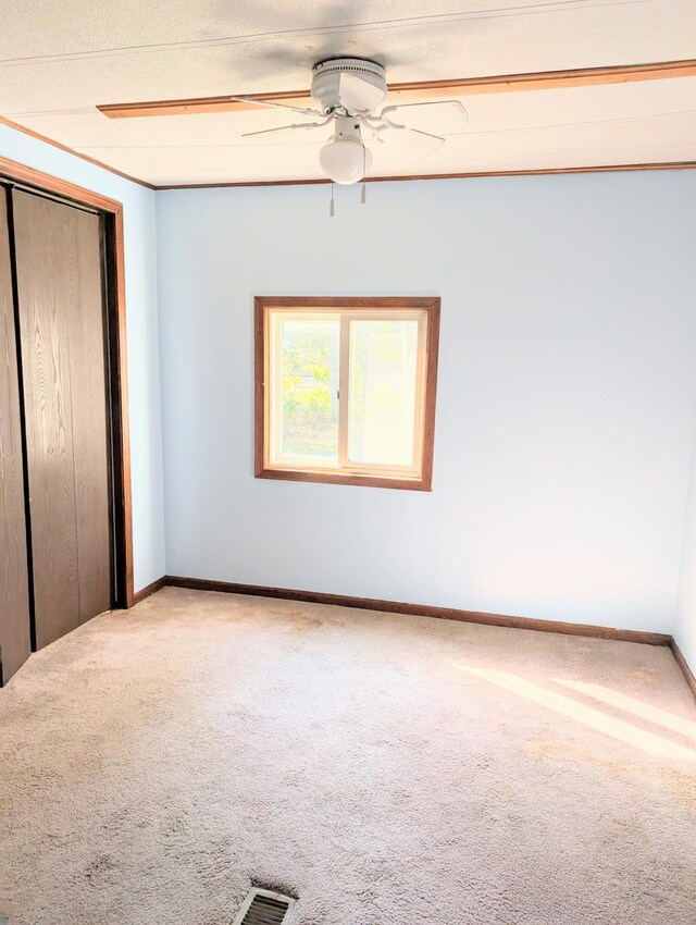 11700 Stultz St, Rockford, MI 49341 - unfurnished bedroom with carpet, a closet, baseboards, and a ceiling fan