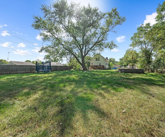 view of yard featuring a trampoline