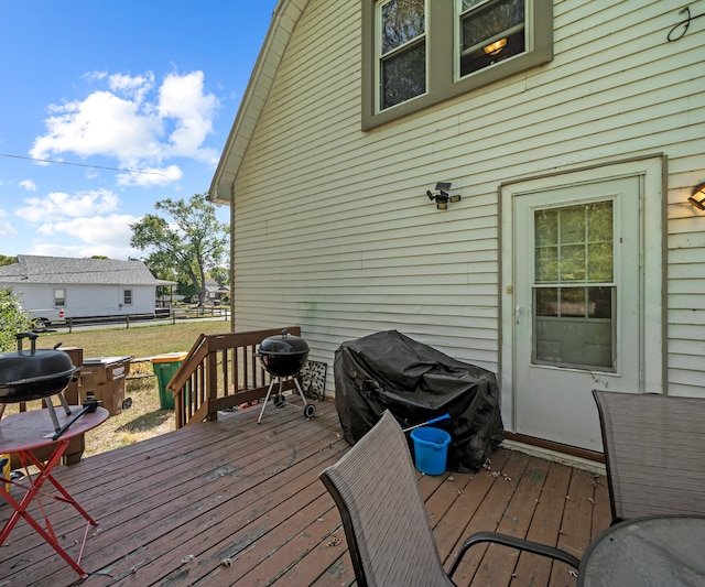 wooden terrace featuring grilling area