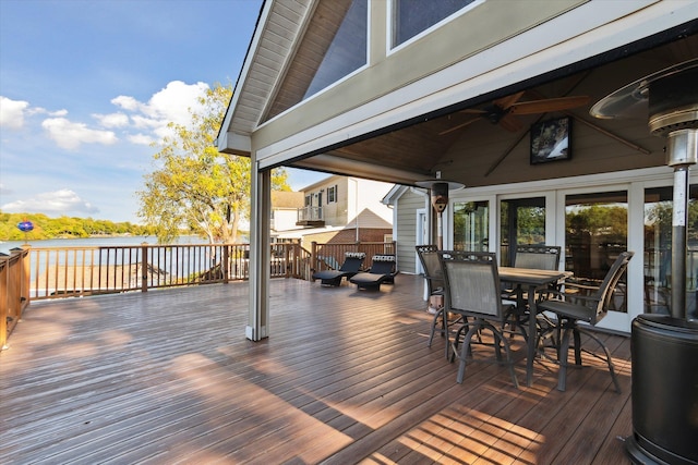 wooden deck featuring ceiling fan