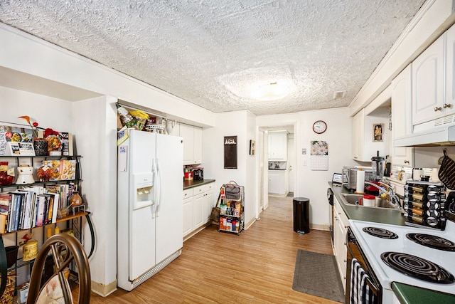 kitchen with light wood-type flooring, white appliances, white cabinetry, and sink