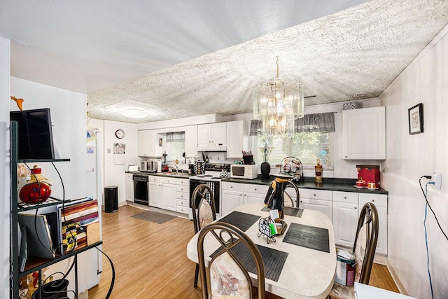 kitchen featuring a textured ceiling, white cabinetry, and stainless steel electric stove