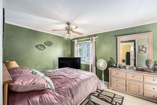 carpeted bedroom with ceiling fan, crown molding, and a textured ceiling