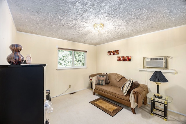 living area with carpet flooring, a textured ceiling, an AC wall unit, and crown molding