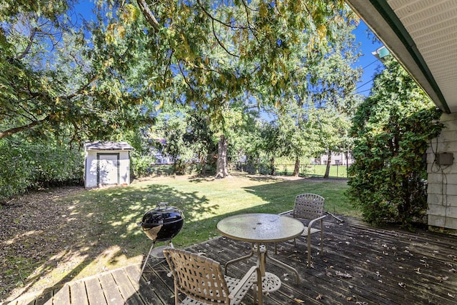 wooden terrace with a yard and a storage shed