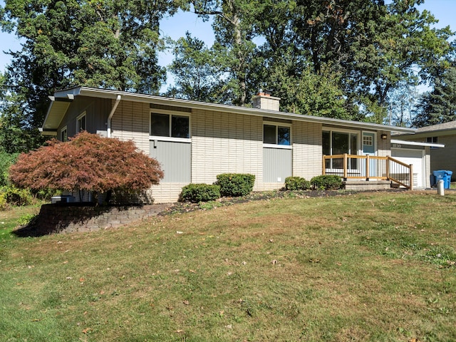 ranch-style home with a front lawn