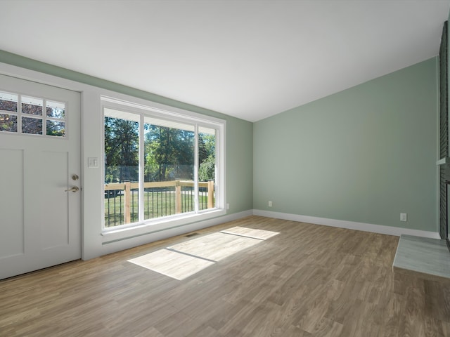 unfurnished living room featuring light hardwood / wood-style flooring