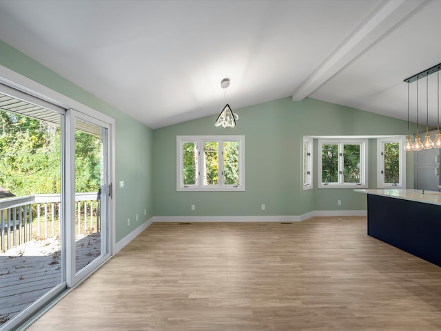 unfurnished dining area with lofted ceiling with beams, light hardwood / wood-style floors, and a wealth of natural light