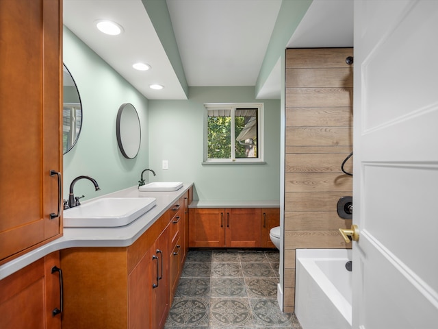 bathroom featuring tile patterned flooring, vanity, and toilet