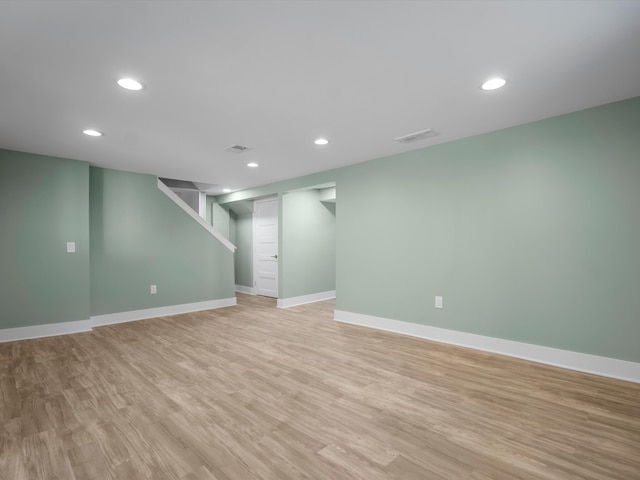 basement featuring light hardwood / wood-style floors