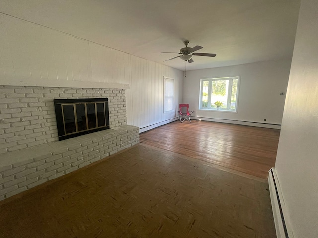 unfurnished living room with dark hardwood / wood-style floors, a brick fireplace, ceiling fan, and a baseboard radiator