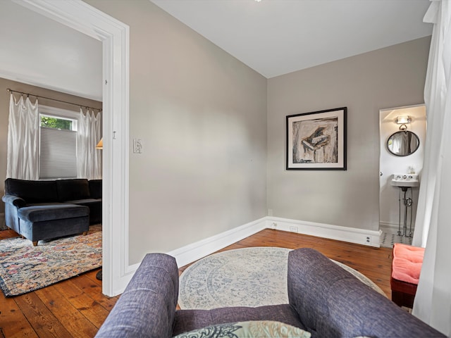 sitting room with wood-type flooring