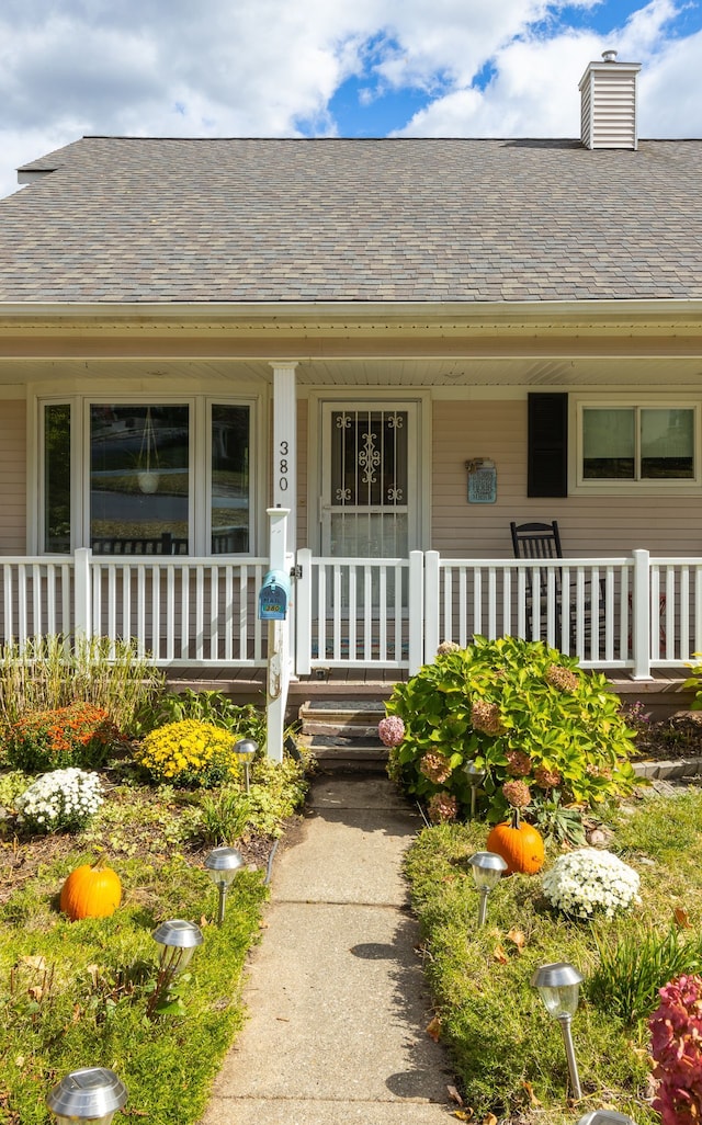 property entrance featuring covered porch